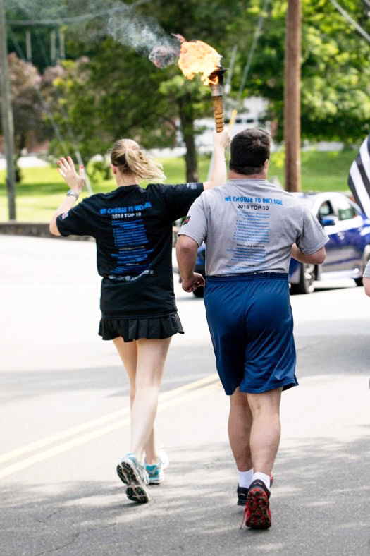 Volunteers running in a mini-marathon in support of Brian House and AVP, Inc.